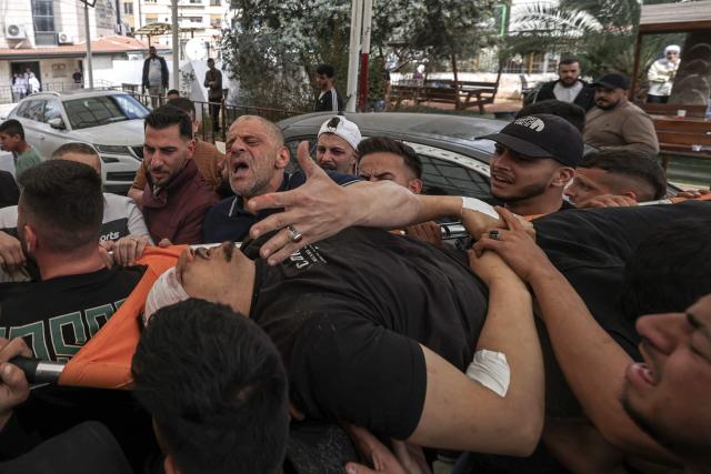 EDITORS NOTE: Graphic content / Mourners carry the body of a Palestinian man, who was allegedly killed in clashes with Israeli soldiers during a raid in the Israeli-occupied West Bank city of Nablus on May 3, 2026. Violence has surged in the Palestinian territory since the start of the war in Gaza in October 2023. According to an AFP tally based on Palestinian health ministry figures, Israeli troops or settlers have killed at least 1,068 Palestinians -- many of them militants, but also scores of civilians -- in the West Bank since then. Official Israeli figures say at least 46 Israelis, including soldiers and civilians, have been killed in Palestinian attacks or during Israeli military operations in the same period. (Photo by JAAFAR ASHTIYEH / AFP)