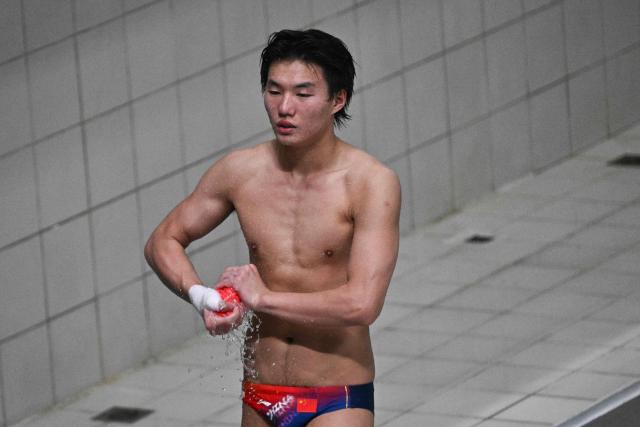 China’s Bai Yuming competes in the men’s 10m platform event at the World Aquatics Diving World Cup Super Finals in Beijing on May 3, 2026. (Photo by Pedro PARDO / AFP)