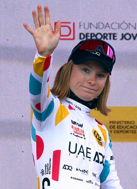 Team ALE - Cipollini's French rider Maeva Squiban celebrates on the podium wearing the best climber's spotted jersey after winning the first stage of the 2026 La Vuelta Femenina cycling tour of Spain, a 113.9 km race between Marin and Salvaterra do Mino, on May 3, 2026. (Photo by Miguel RIOPA / AFP)