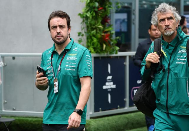 Aston Martin's Spanish driver Fernando Alonso (L) arrives ahead of the 2026 Miami Formula One Grand Prix at Miami International Autodrome in Miami Gardens, Florida, on May 3, 2026. (Photo by CHARLY TRIBALLEAU / AFP)