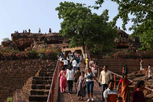 People visit the Udayagiri and Khandagiri Caves in Bhubaneswar on May 3, 2026. (Photo by Niharika KULKARNI / AFP)