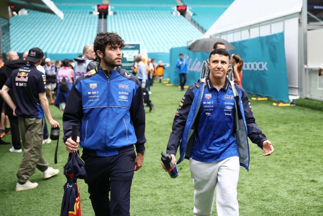 Red Bull Racing's French driver Isack Hadjar (R) arrives ahead of the 2026 Miami Formula One Grand Prix at Miami International Autodrome in Miami Gardens, Florida, on May 3, 2026. (Photo by CHARLY TRIBALLEAU / AFP)