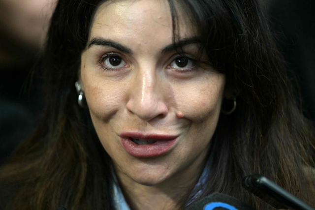 (FILES) Gianinna Maradona, daughter of Argentine football legend Diego Maradona, speaks to the media outside the court for a trial hearing on her father's death in San Isidro, Buenos Aires province, Argentina on April 21, 2026. Diego Maradona's entourage and medical team had a plan for the Argentine football star but things "went out of control" in the lead-up to his death, his daughter Gianinna said in an interview published on May 3, 2026. (Photo by Juan MABROMATA / AFP)
