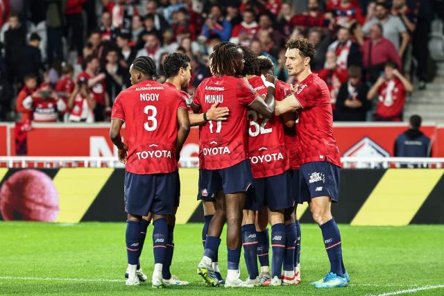 Lille's players celebrate their team's first goal during the French L1 football match between Lille LOSC and Le Havre AC at the Pierre Mauroy stadium in Villeneuve-d'Ascq, northern France, on May 3, 2026. (Photo by Sameer Al-DOUMY / AFP)