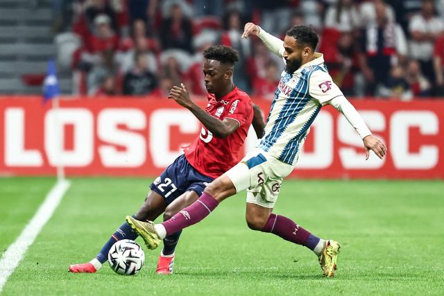 Lille's Portuguese forward #27 Felix Correia (L) fights for the ball with Le Havre's Moroccan midfielder #17 Sofiane Boufal during the French L1 football match between Lille LOSC and Le Havre AC at the Pierre Mauroy stadium in Villeneuve-d'Ascq, northern France, on May 3, 2026. (Photo by Sameer Al-DOUMY / AFP)