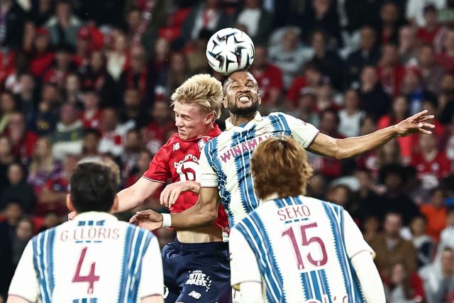 Le Havre's Hungarian defender #07 Loic Nego (R) heads the ball next to Lille's Icelandic midfielder #10 Hakon Arnar Haraldsson during the French L1 football match between Lille LOSC and Le Havre AC at the Pierre Mauroy stadium in Villeneuve-d'Ascq, northern France, on May 3, 2026. (Photo by Sameer Al-DOUMY / AFP)
