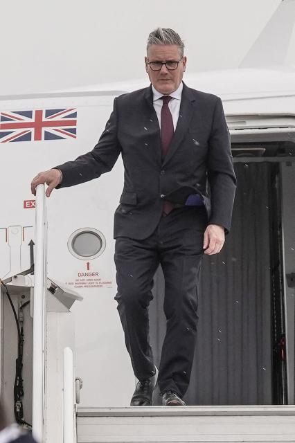 Britain's Prime Minister Keir Starmer disembarks from an airplane upon arrival to the airport ahead of attending the 8th European Political Community (EPC) summit in Yerevan on May 3, 2026. (Photo by Stefan Rousseau / POOL / AFP)