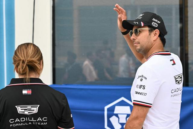 Cadillac's Mexican driver Sergio Perez waves to fans as he arrives for the Driver's Parade before the 2026 Miami Formula One Grand Prix at Miami International Autodrome in Miami Gardens, Florida, on May 3, 2026. (Photo by CHANDAN KHANNA / AFP)