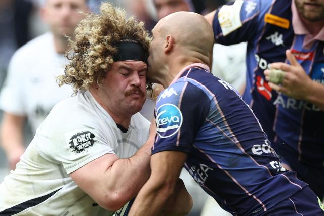Bath's English number 8 Alfie Barbeary (L) is tackled by Bordeaux-Begles' French scrum-half Maxime Lucu during the European Champions Cup semi-final rugby union match between Union Bordeaux Belges (UBB) and Bath Rugby at the Atlantique Bordeaux Metropole Stadium in Bordeaux, southwestern France, on May 3, 2026. (Photo by ROMAIN PERROCHEAU / AFP)