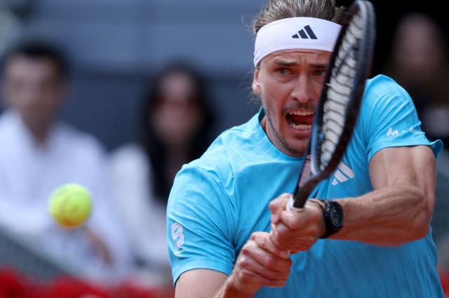 Germany's Alexander Zverev returns a ball to Italy's Jannik Sinner during the 2026 ATP Tour Madrid Open tennis tournament final singles match at the Caja Magica in Madrid, on May 3, 2026. (Photo by Thomas COEX / AFP)
