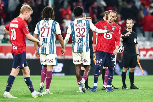Lille's French midfielder #08 Ethan Mbappe (2nd R) greet Le Havre's players at the end of the French L1 football match between Lille LOSC and Le Havre AC at the Pierre Mauroy stadium in Villeneuve-d'Ascq, northern France, on May 3, 2026. (Photo by Sameer Al-DOUMY / AFP)