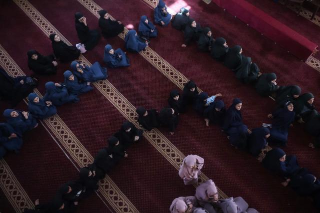 Some 470 Palestinian girls and young women attend a Quran recitation circle at the Al-Nour Quran Memorization Center following a long hiatus due to the war between the Israeli military and Palestinian Hamas militants, in Khan Yunis in the southern Gaza Strip on May 3, 2026. The Quran recitation study circle gathers the faithful around a teacher or a shared text for the purpose of learning, recitation, discussion, or spiritual development. The war on the Gaza Strip was sparked following the militant Palestinian group Hamas's October 7, 2023 attack on Israel, which resulted in the deaths of 1,221 people. Israel's retaliatory assault on Gaza has killed at least 72,600 people, according to figures from the health ministry that the UN considers reliable, with the majority of Gaza's 2.4 million people being displaced. (Photo by Bashar Taleb / AFP)