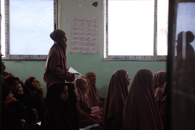 Some 470 Palestinian girls and young women attend a Quran recitation circle at the Al-Nour Quran Memorization Center following a long hiatus due to the war between the Israeli military and Palestinian Hamas militants, in Khan Yunis in the southern Gaza Strip on May 3, 2026. The Quran recitation study circle gathers the faithful around a teacher or a shared text for the purpose of learning, recitation, discussion, or spiritual development. The war on the Gaza Strip was sparked following the militant Palestinian group Hamas's October 7, 2023 attack on Israel, which resulted in the deaths of 1,221 people. Israel's retaliatory assault on Gaza has killed at least 72,600 people, according to figures from the health ministry that the UN considers reliable, with the majority of Gaza's 2.4 million people being displaced. (Photo by Bashar Taleb / AFP)