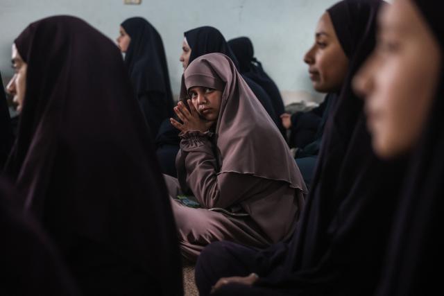 Some 470 Palestinian girls and young women attend a Quran recitation circle at the Al-Nour Quran Memorization Center following a long hiatus due to the war between the Israeli military and Palestinian Hamas militants, in Khan Yunis in the southern Gaza Strip on May 3, 2026. The Quran recitation study circle gathers the faithful around a teacher or a shared text for the purpose of learning, recitation, discussion, or spiritual development. The war on the Gaza Strip was sparked following the militant Palestinian group Hamas's October 7, 2023 attack on Israel, which resulted in the deaths of 1,221 people. Israel's retaliatory assault on Gaza has killed at least 72,600 people, according to figures from the health ministry that the UN considers reliable, with the majority of Gaza's 2.4 million people being displaced. (Photo by Bashar Taleb / AFP)