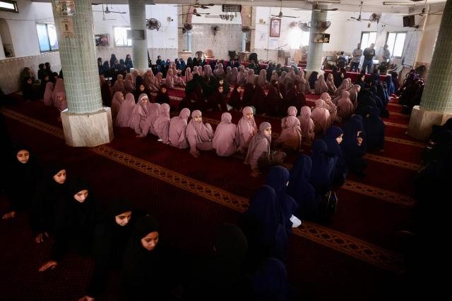 Some 470 Palestinian girls and young women attend a Quran recitation circle at the Al-Nour Quran Memorization Center following a long hiatus due to the war between the Israeli military and Palestinian Hamas militants, in Khan Yunis in the southern Gaza Strip on May 3, 2026. The Quran recitation study circle gathers the faithful around a teacher or a shared text for the purpose of learning, recitation, discussion, or spiritual development. The war on the Gaza Strip was sparked following the militant Palestinian group Hamas's October 7, 2023 attack on Israel, which resulted in the deaths of 1,221 people. Israel's retaliatory assault on Gaza has killed at least 72,600 people, according to figures from the health ministry that the UN considers reliable, with the majority of Gaza's 2.4 million people being displaced. (Photo by Bashar Taleb / AFP)