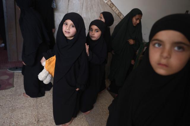 Some of the 470 Palestinian girls and young women arrive to attend a Quran recitation circle at the Al-Nour Quran Memorization Center following a long hiatus due to the war between the Israeli military and Palestinian Hamas militants, in Khan Yunis in the southern Gaza Strip on May 3, 2026. The Quran recitation study circle gathers the faithful around a teacher or a shared text for the purpose of learning, recitation, discussion, or spiritual development. The war on the Gaza Strip was sparked following the militant Palestinian group Hamas's October 7, 2023 attack on Israel, which resulted in the deaths of 1,221 people. Israel's retaliatory assault on Gaza has killed at least 72,600 people, according to figures from the health ministry that the UN considers reliable, with the majority of Gaza's 2.4 million people being displaced. (Photo by Bashar Taleb / AFP)