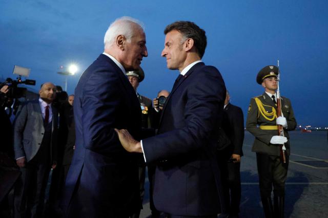 France's President Emmanuel Macron is welcomed by Armenia's President Vahagn Khachaturyan at the airport upon his arrival for the 8th European Political Community (EPC) summit in Yerevan on May 3, 2026. (Photo by Ludovic MARIN / AFP)