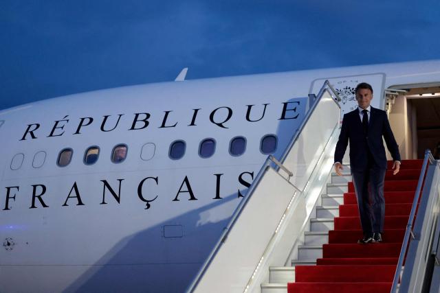 France's President Emmanuel Macron disembarks from his airplane at the airport upon his arrival for the 8th European Political Community (EPC) summit in Yerevan on May 3, 2026. (Photo by Ludovic MARIN / AFP)