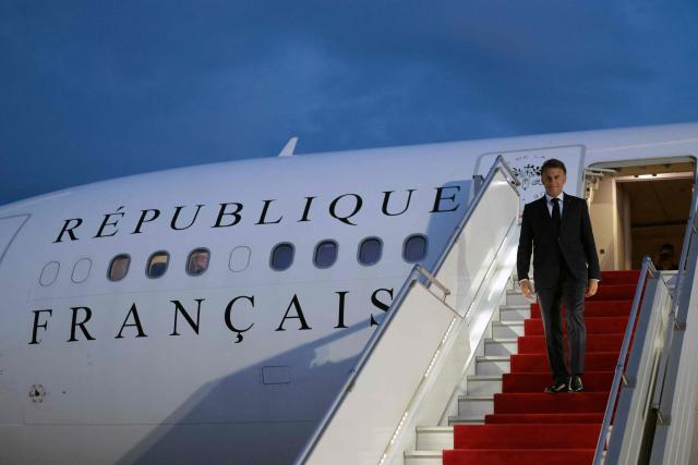 France's President Emmanuel Macron disembarks from his airplane at the airport upon his arrival for the 8th European Political Community (EPC) summit in Yerevan on May 3, 2026. (Photo by Ludovic MARIN / AFP)