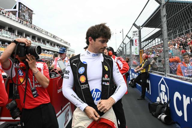 Ferrari's Monegasque driver Charles Leclerc makes his way to the grid before the start of 2026 Miami Formula One Grand Prix at Miami International Autodrome in Miami Gardens, Florida, on May 3, 2026. (Photo by CHANDAN KHANNA / AFP)