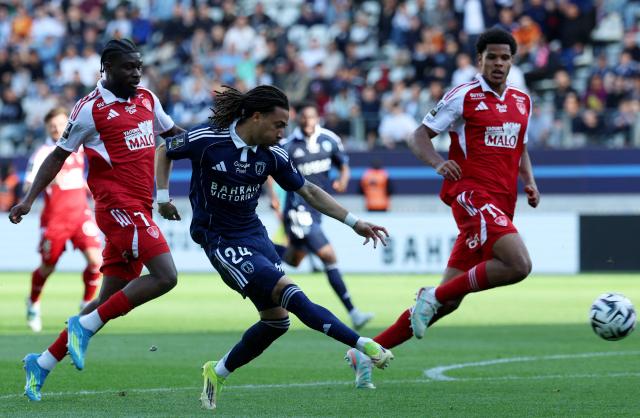 Paris FC's Italian forward #24 Luca Koleosho kicks the ball during the French L1 football match between Paris FC and Stade Brestois 29  at the Charlety stadium in Paris on May 3, 2026. (Photo by FRANCK FIFE / AFP)