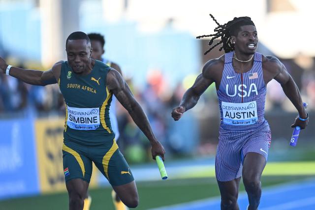 US' Pjai Austin (R) crosses the finish line ahead of South Africa's Akani Simbine (L) to win the men's 4x100m relay final during the Gaborone 26 World Athletics Relays at the National Stadium in Gaborone on May 3, 2026. (Photo by AFP)