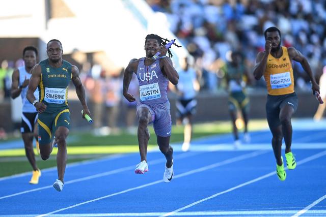 US' Pjai Austin (C) leads ahead of South Africa's Akani Simbine (L) and Germany's Lucas Ansah-Peprah (R) during the men's 4x100m relay final during the Gaborone 26 World Athletics Relays at the National Stadium in Gaborone on May 3, 2026. (Photo by AFP)