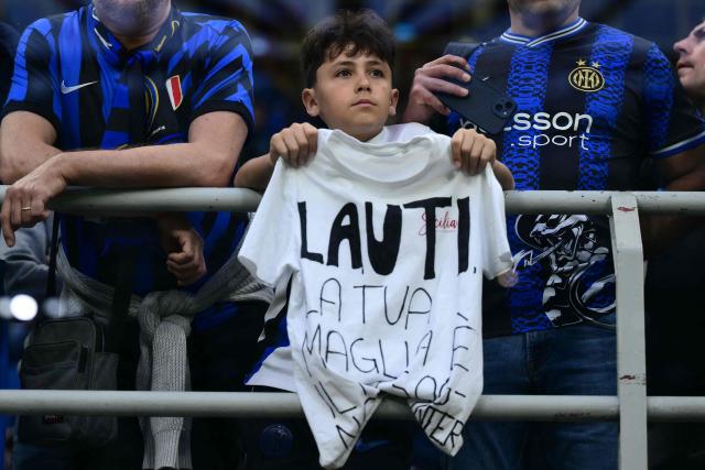 A young fan of Inter Milan's Argentinian forward #10 Lautaro Martinez waits for the start of the Italian Serie A football match between Inter Milan and Parma at San Siro stadium in Milan, on May 3, 2026. (Photo by Marco BERTORELLO / AFP)
