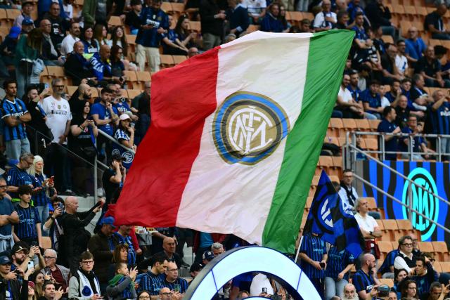 Inter Milan's supporters wave a giant flag before the start of the Italian Serie A football match between Inter Milan and Parma at San Siro stadium in Milan, on May 3, 2026. (Photo by Stefano RELLANDINI / AFP)