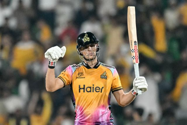 Peshawar Zalmi's Australian cricket player Aaron Hardie celebrates after scoring a half-century (50 runs) during the Pakistan Super League (PSL) Twenty20 final match between Hyderabad Kingsmen and Peshawar Zalmi at the Gaddafi Stadium in Lahore on May 3, 2026. (Photo by Arif ALI / AFP)