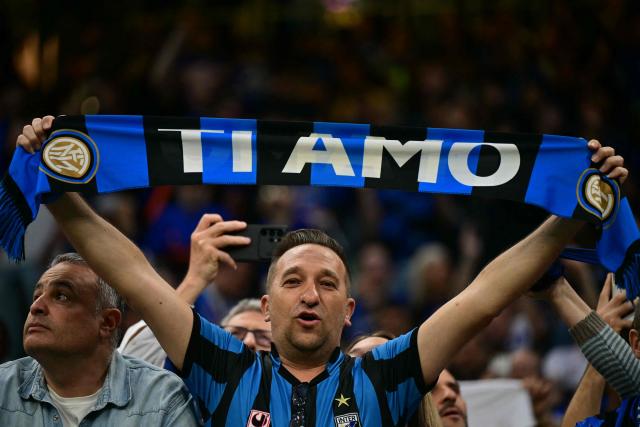 Supporters of Inter Milan cheer before the start of the Italian Serie A football match between Inter Milan and Parma at San Siro stadium in Milan, on May 3, 2026. (Photo by Stefano RELLANDINI / AFP)