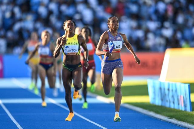US' Bailey Lear (R) leads ahead of Jamaica's Rushell Clayton (L) during the mixed 4x400m relay final during the Gaborone 26 World Athletics Relays at the National Stadium in Gaborone on May 3, 2026. (Photo by AFP)