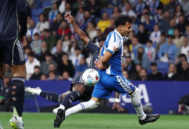 Espanyol's Moroccan defender #23 Omar El Hilali fights for the ball with Real Madrid's Brazilian forward #07 Vinicius Junior during the Spanish league football match between RCD Espanyol and Real Madrid CF at RCDE Stadium in Cornella de Llobregat on May 3, 2026. (Photo by Josep LAGO / AFP)