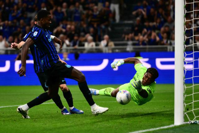 Inter Milan's French forward #9 Marcus Thuram fails to score against Parma's Japanese goalkeeper #31 Zion Suzuki during the Italian Serie A football match between Inter Milan and Parma at San Siro stadium in Milan, on May 3, 2026. (Photo by Marco BERTORELLO / AFP)