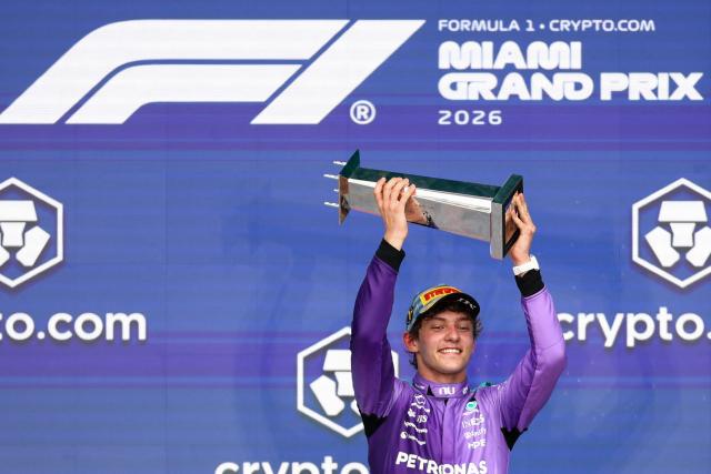 Race winner Mercedes' Italian driver Kimi Antonelli holds the trophy as he celebrates on the podium after the 2026 Miami Formula One Grand Prix at Miami International Autodrome in Miami Gardens, Florida, on May 3, 2026. (Photo by CHARLY TRIBALLEAU / AFP)