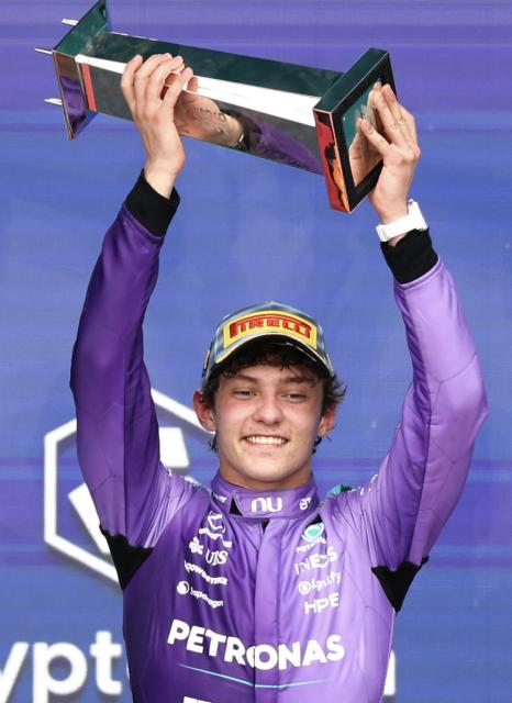Race winner Mercedes' Italian driver Kimi Antonelli holds the trophy as he celebrates on the podium after the 2026 Miami Formula One Grand Prix at Miami International Autodrome in Miami Gardens, Florida, on May 3, 2026. (Photo by CHARLY TRIBALLEAU / AFP)