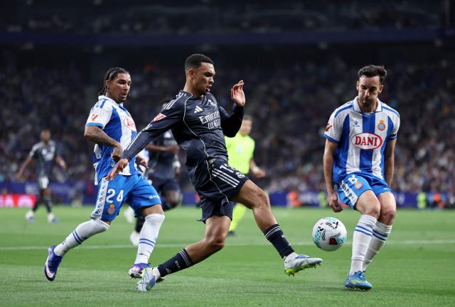 Real Madrid's English defender #12 Trent Alexander-Arnold fights for the ball with Espanyol's English forward #24 Tyrhys Dolan and Espanyol's Spanish midfielder #08 Edu Exposito during the Spanish league football match between RCD Espanyol and Real Madrid CF at RCDE Stadium in Cornella de Llobregat on May 3, 2026. (Photo by Josep LAGO / AFP)