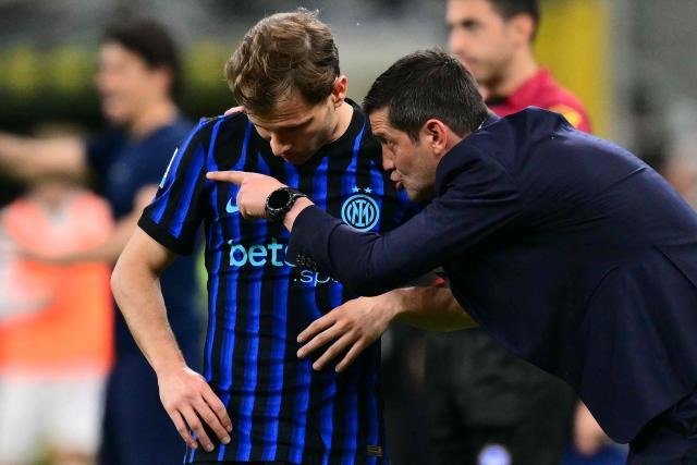 Inter Milan's Romanian head coach Cristian Chivu gives instructions to Inter Milan's Italian midfielder #23 Nicolo Barella during the Italian Serie A football match between Inter Milan and Parma at San Siro stadium in Milan, on May 3, 2026. (Photo by Stefano RELLANDINI / AFP)