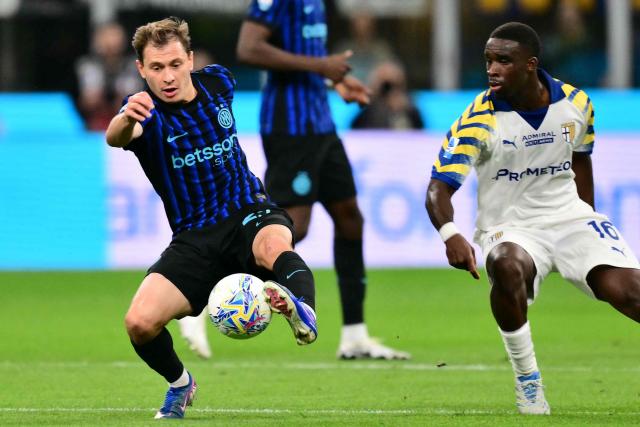 Inter Milan's Italian midfielder #23 Nicolo Barella controls the ball next to Parma's Belgian midfielder #16 Mandela Keita during the Italian Serie A football match between Inter Milan and Parma at San Siro stadium in Milan, on May 3, 2026. (Photo by Stefano RELLANDINI / AFP)