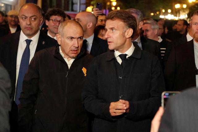 France's President Emmanuel Macron is welcomed by Armenia's President Vahagn Khachaturyan walk on a street after a diner on the eve of the 8th European Political Community (EPC) summit in Yerevan on May 3, 2026. (Photo by Ludovic MARIN / AFP)