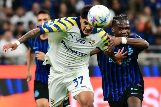 Parma's Argentinian defender #37 Mariano Troilo fights for the ball with Inter Milan's French forward #14 Ange-Yoan Bonny during the Italian Serie A football match between Inter Milan and Parma at San Siro stadium in Milan, on May 3, 2026. (Photo by Stefano RELLANDINI / AFP)
