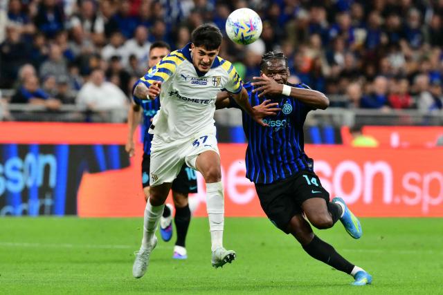 Parma's Argentinian defender #37 Mariano Troilo fights for the ball with Inter Milan's French forward #14 Ange-Yoan Bonny during the Italian Serie A football match between Inter Milan and Parma at San Siro stadium in Milan, on May 3, 2026. (Photo by Stefano RELLANDINI / AFP)