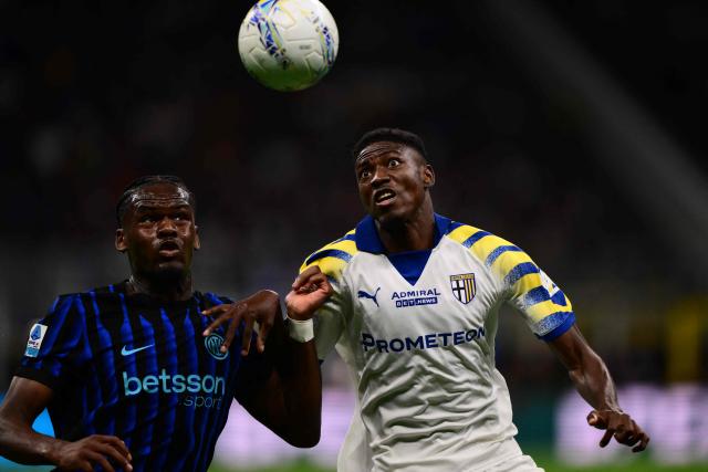 Inter Milan's French forward #14 Ange-Yoan Bonny fights for the ball with Parma's Senegalese defender #03 Abdoulaye Ndiaye (R) during the Italian Serie A football match between Inter Milan and Parma at San Siro stadium in Milan, on May 3, 2026. (Photo by Marco BERTORELLO / AFP)