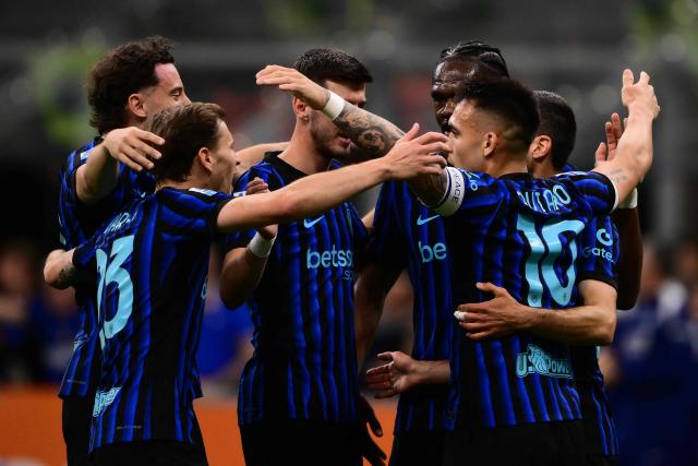 Inter Milan's Armenian forward #22 Henrikh Mkhitaryan (R) celebrates scoring his team's second goal with teammates during the Italian Serie A football match between Inter Milan and Parma at San Siro stadium in Milan, on May 3, 2026. (Photo by Marco BERTORELLO / AFP)