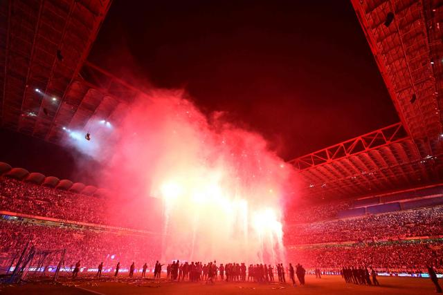 A general view shows fireworks after Inter Milan won their 21st 'scudetto' following the Italian Serie A football match between Inter Milan and Parma at San Siro stadium in Milan, on May 3, 2026. (Photo by Stefano RELLANDINI / AFP)