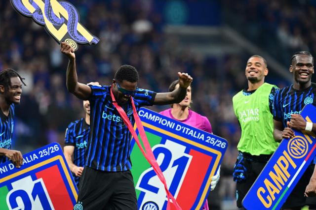 Inter Milan's French forward #9 Marcus Thuram celebrates with teammates after winning their 21st 'scudetto' following the Italian Serie A football match between Inter Milan and Parma at San Siro stadium in Milan, on May 3, 2026. (Photo by Stefano Rellandini / AFP)