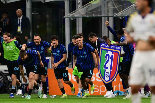 from left : Inter Milan's Italian forward #94 Pio Esposito, Inter Milan's Italian defender #15 Francesco Acerbi, Inter Milan's Dutch defender #6 Stefan De Vrij, Inter Milan's Italian defender #43 Matteo Cocchi, Inter Milan's Brazilian forward #11 Luis Henrique, Inter Milan's Romanian head coach Cristian Chivu and Inter Milan's French forward #9 Marcus Thuram celebrate after winning their 21st 'scudetto' following the Italian Serie A football match between Inter Milan and Parma at San Siro stadium in Milan, on May 3, 2026. (Photo by Marco BERTORELLO / AFP)
