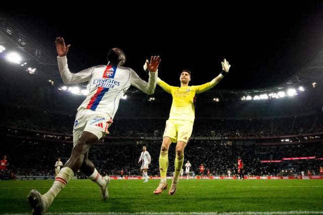 Lyon's Slovak goalkeeper #01 Dominik Greif (C) and Lyon's Angolan defender #22 Clinton Mata (L) react during the French L1 football match between Olympique Lyonnais and Rennes at the Groupama Stadium in Decines-Charpieu, central-eastern France, on May 3, 2026. (Photo by OLIVIER CHASSIGNOLE / AFP)