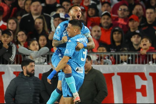 Atletico Tucuman's midfielder #11 Renzo Tesuri (L) celebrates with teammate Uruguayan defender #03 Maximiliano Villa after scoring during the Argentine Professional Football League 2026 Apertura tournament match between River Plate and Atletico Tucuman, at the Mas Monumental stadium in Buenos Aires on May 3, 2026. (Photo by ALEJANDRO PAGNI / AFP)
