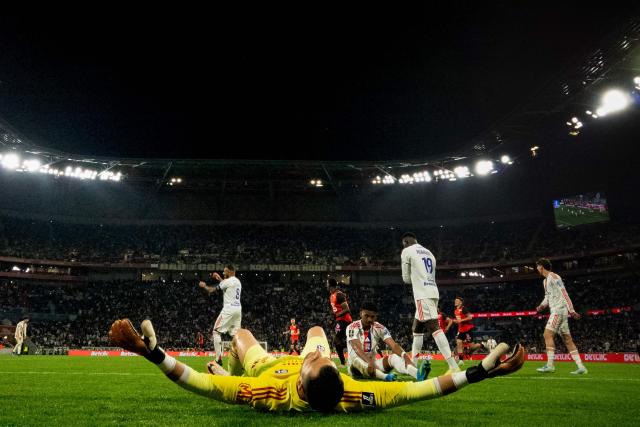 Lyon's Slovak goalkeeper #01 Dominik Greif (C) reacts after conceding a goal during the French L1 football match between Olympique Lyonnais and Rennes at the Groupama Stadium in Decines-Charpieu, central-eastern France, on May 3, 2026. (Photo by OLIVIER CHASSIGNOLE / AFP)